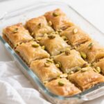 Freshly baked pistachio cardamom baklava bites with citrus syrup
