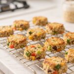 Baked veggie quinoa bites cooling on wire rack