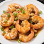 Honey garlic shrimp with glossy sauce served on a plate
