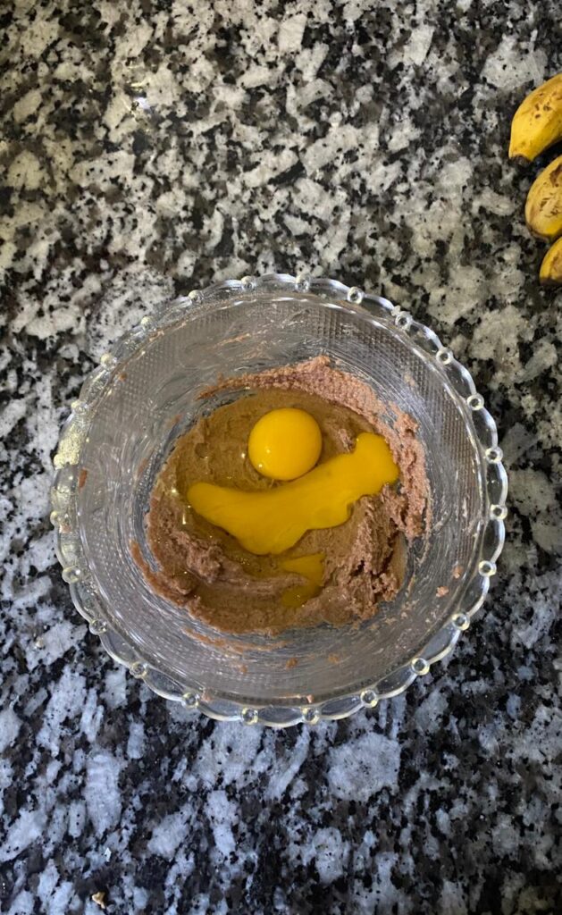 Adding beaten eggs and vanilla extract to the mixture