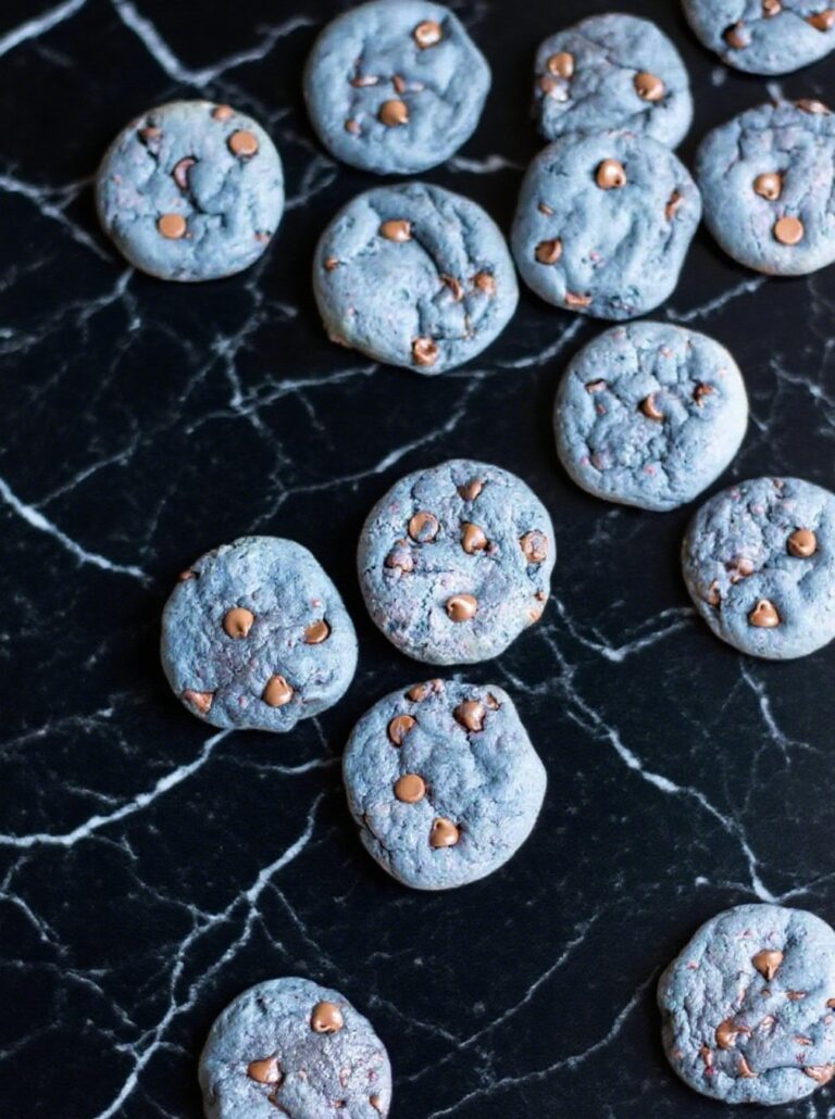 Freshly baked blackberry cookies with melted chocolate chips on tray