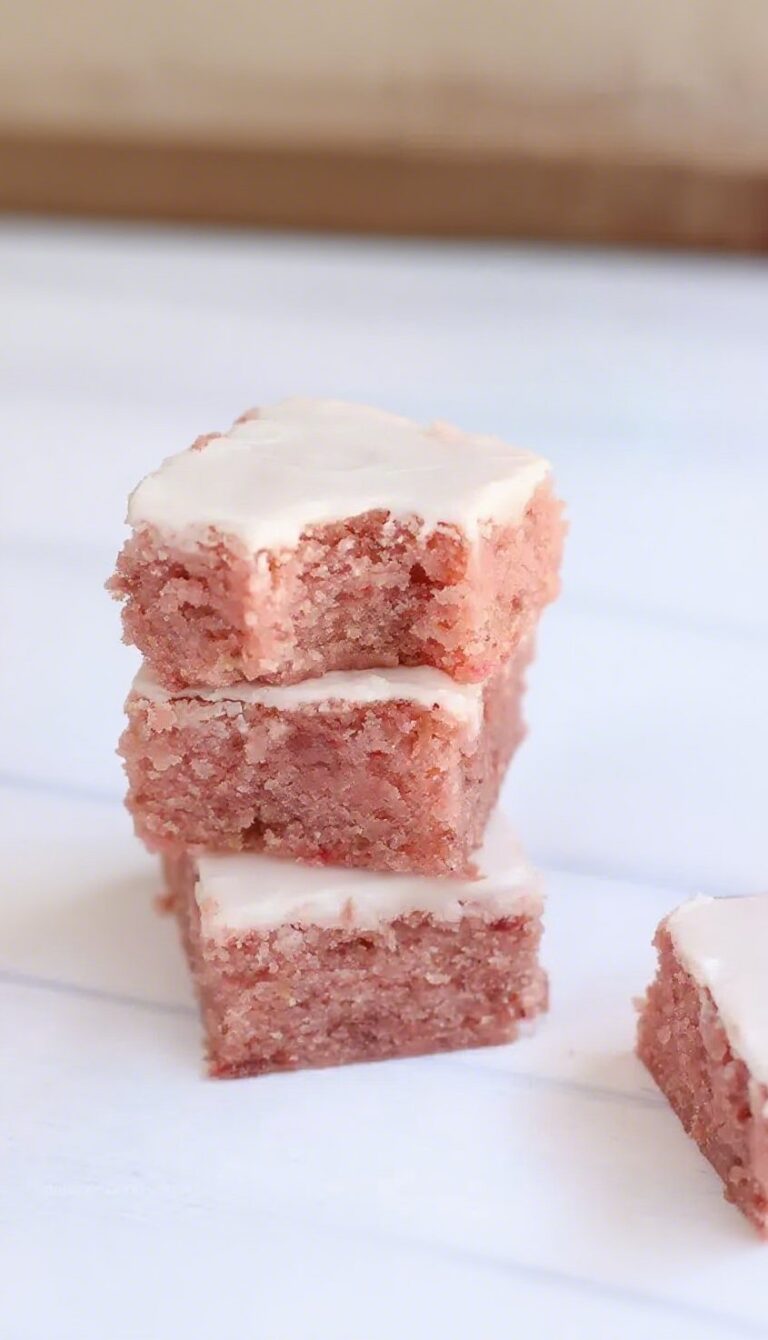 Freshly baked strawberry brownies with silky glaze.