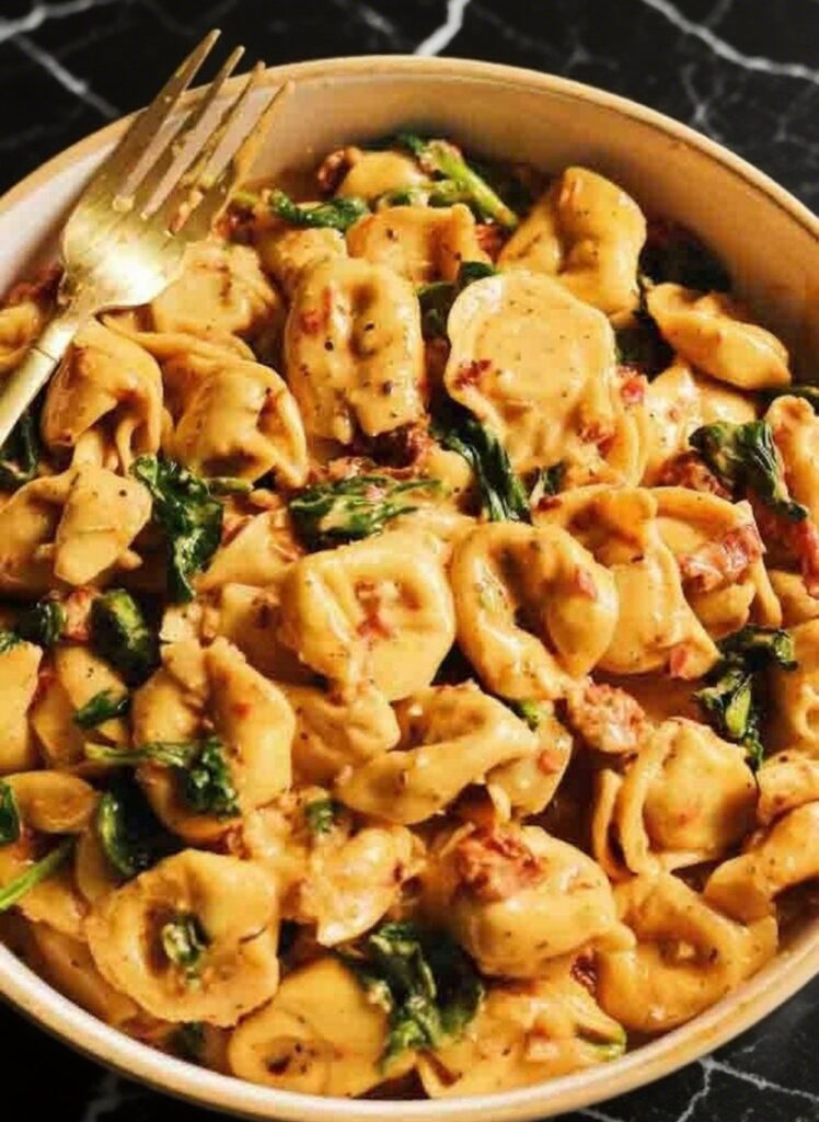 Marry Me Tortellini in creamy sauce with sun-dried tomatoes and spinach