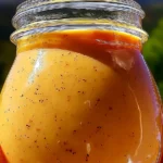 Shut Yo Mouth Sauce in a bowl garnished with herbs