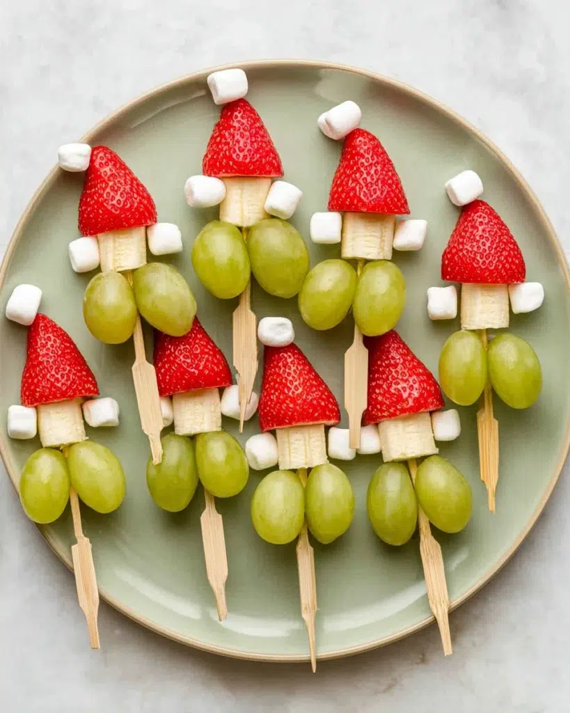 The preparation steps of Grinch Fruit Kabobs